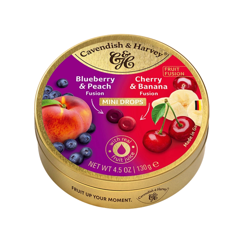 A round gold tin of Cavendish & Harvey Fruit Fusion Mini Drops, featuring a colorful label with blueberries, peaches, cherries, and banana illustrations on a white background. Main image