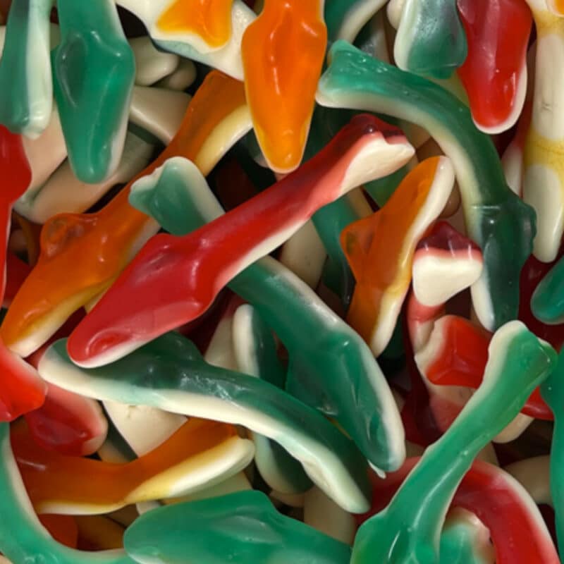 mix of green, red and oragne gummy sharks